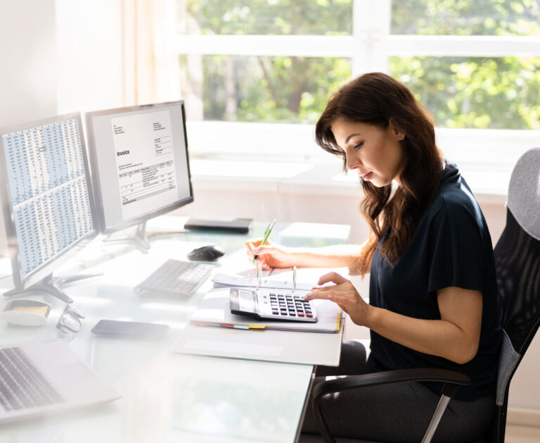 A female accountant entering financial statements into software for bookkeeping for startups